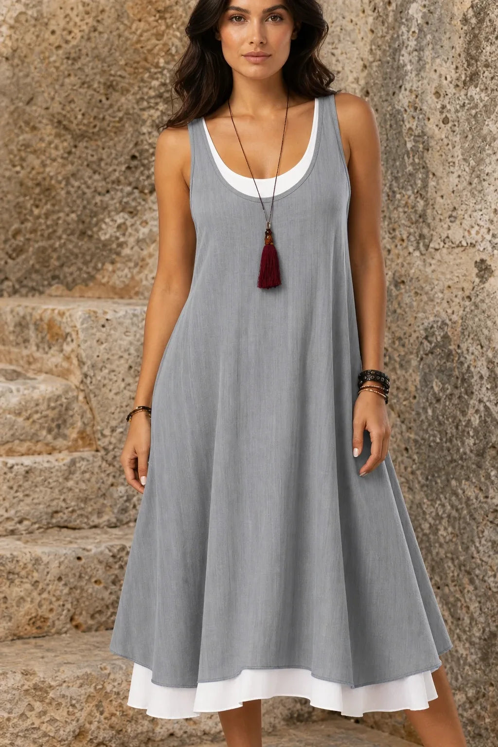 Gray layered mini dress on model in contrapposto stance, front view