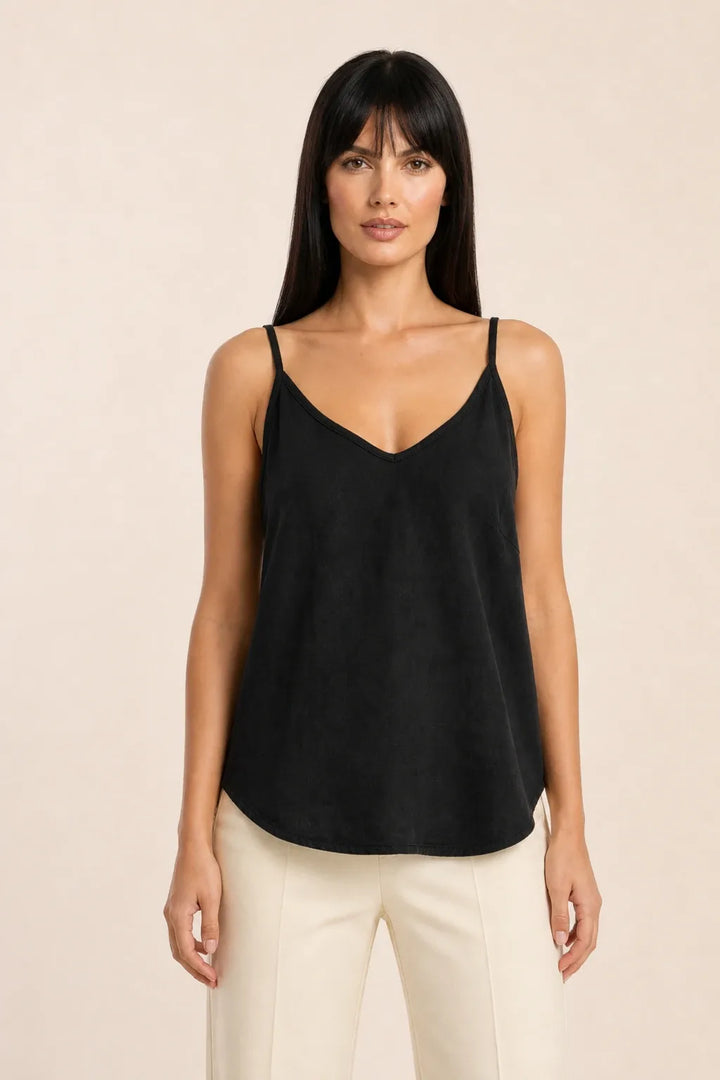 Black spaghetti strap cami on model in contrapposto stance