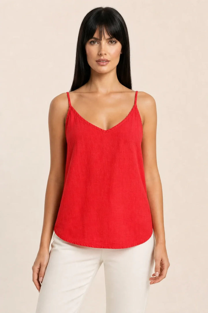 Red spaghetti strap cami on model in contrapposto stance