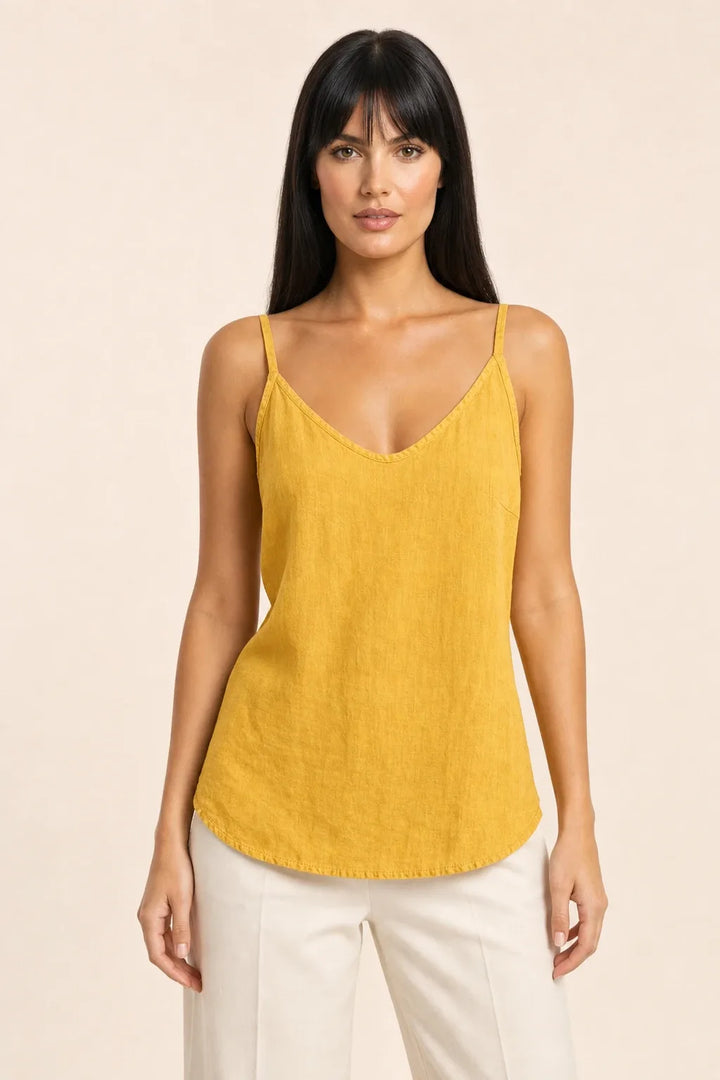 Yellow spaghetti strap cami on model in contrapposto stance