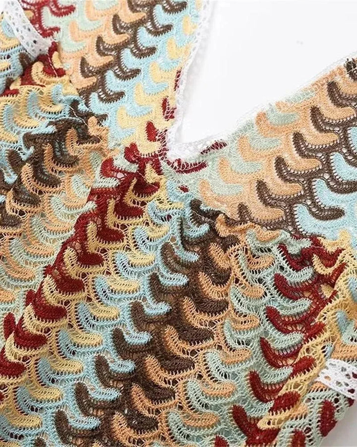 Woman modeling a beige multicolor crochet halter maxi dress, full-length view