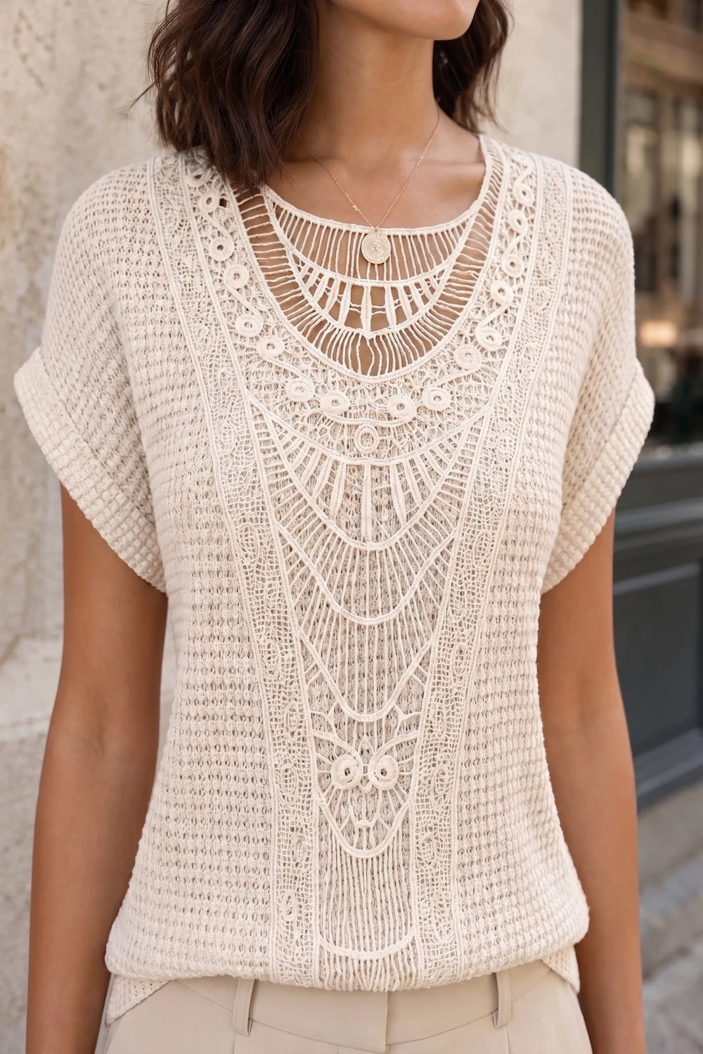 Close-up detail of beige crochet panel top fabric and texture