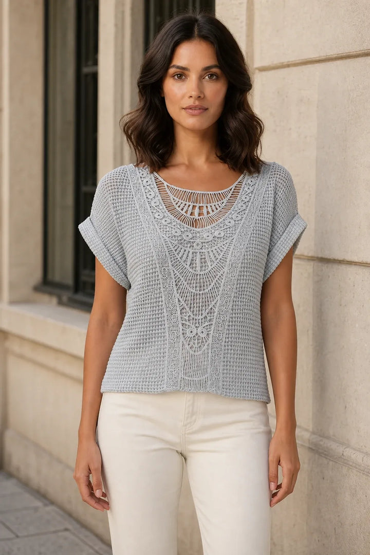 Gray crochet panel top on model in contrapposto stance, front view