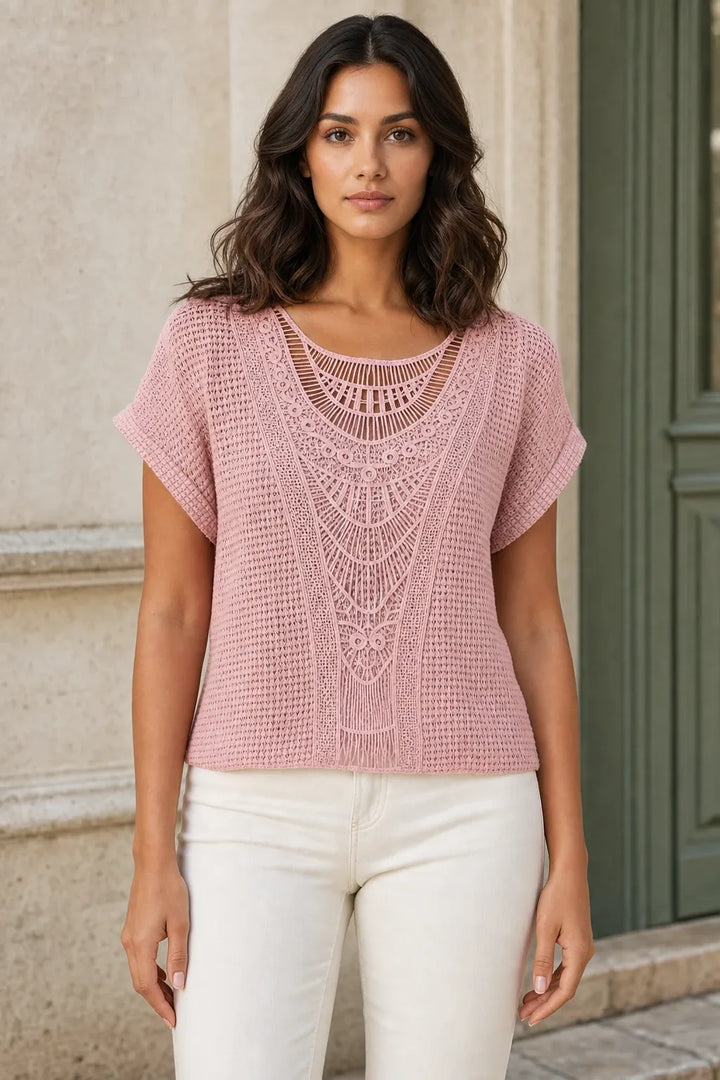 Pink crochet panel top on model in contrapposto stance, front view