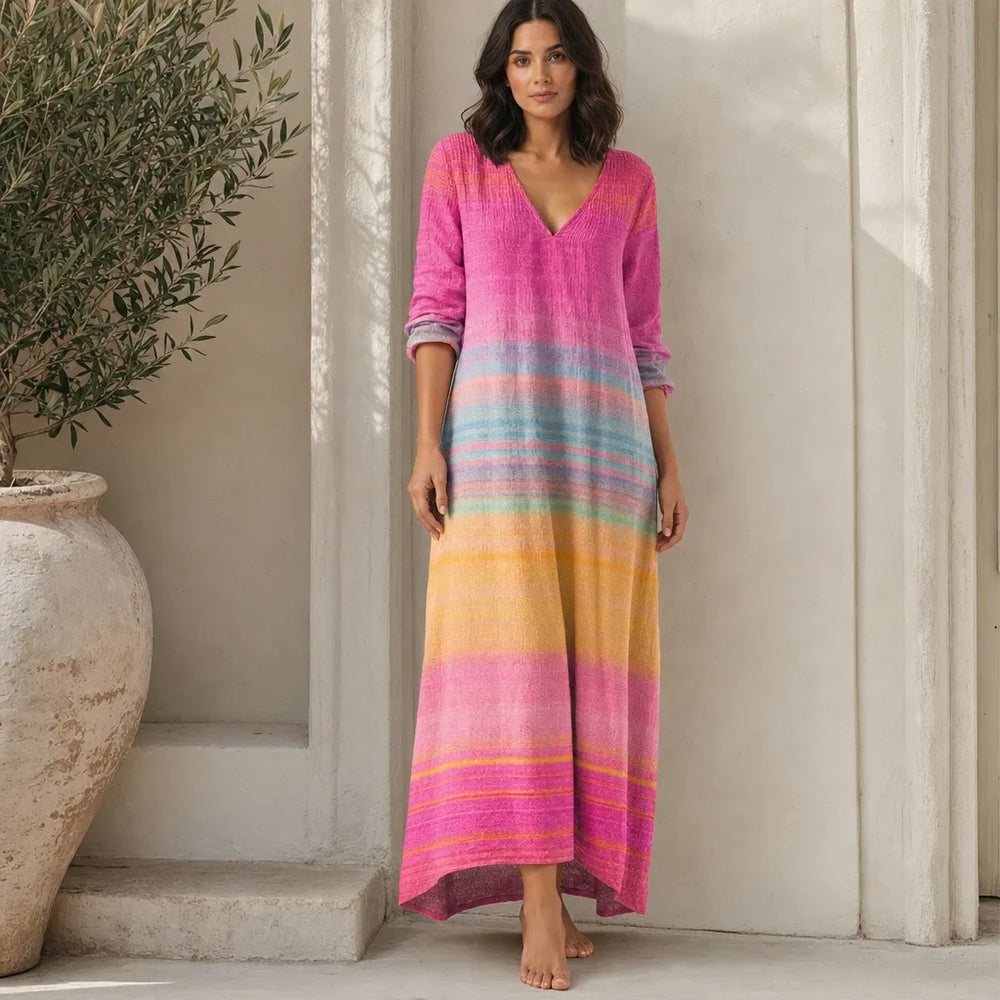 Pink gradient stripe maxi dress on model in contrapposto stance