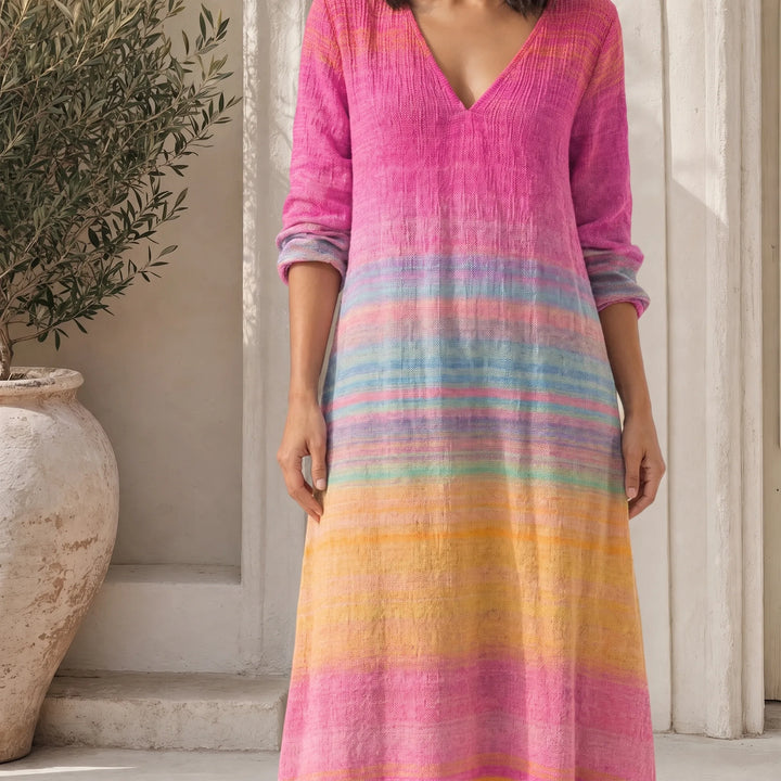 Close-up detail of pink gradient stripe maxi dress fabric and hem