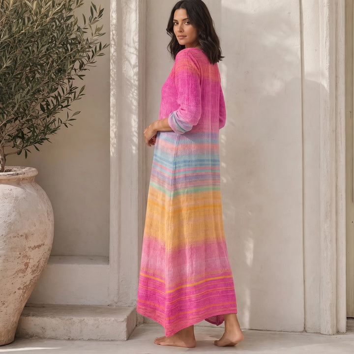 Pink gradient stripe maxi dress on model in three-quarter turn