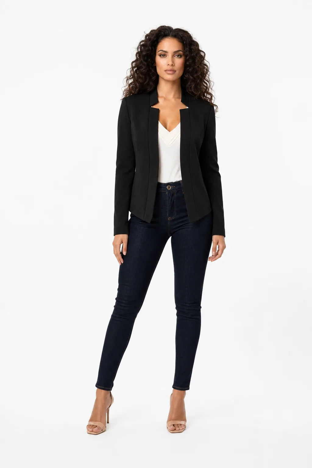 Black collarless open-front blazer on a model in a contrapposto stance
