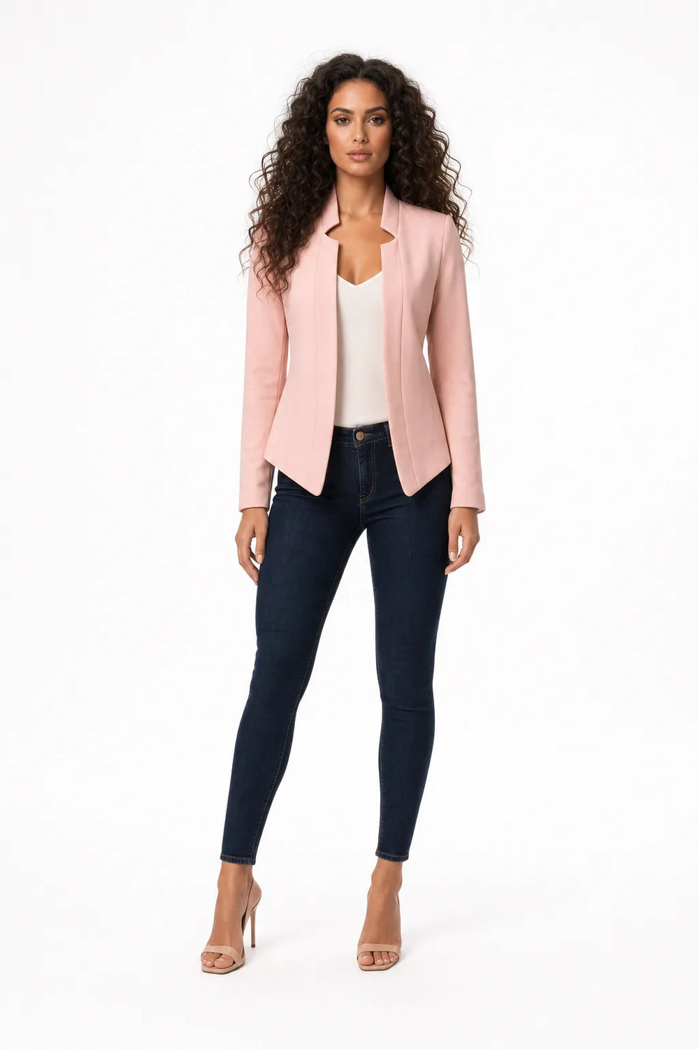 Pink collarless open-front blazer on a model in a contrapposto stance