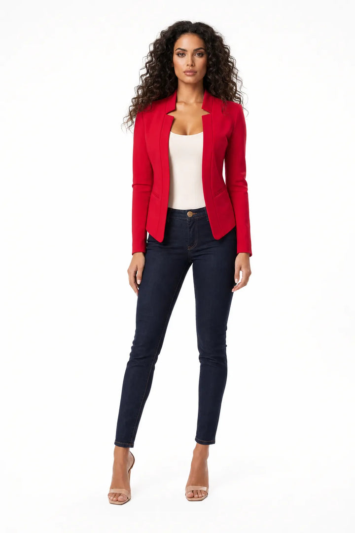 Red collarless open-front blazer on a model in a contrapposto stance