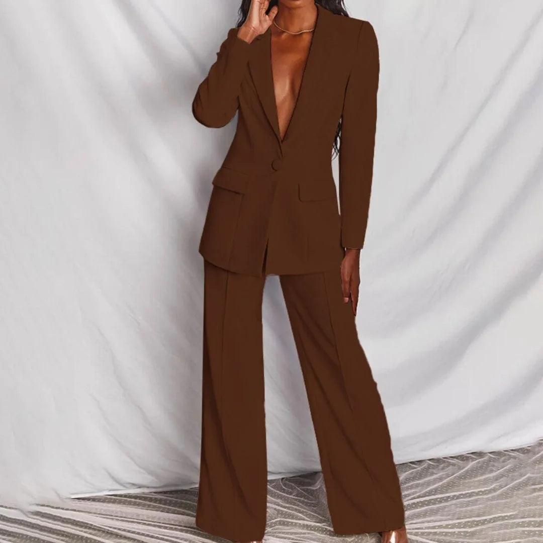 Woman wearing a coffee brown tailored blazer suit set, full-length view