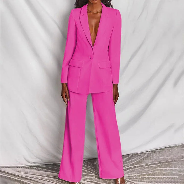 Woman in a pink tailored blazer suit set, full-length fashion pose