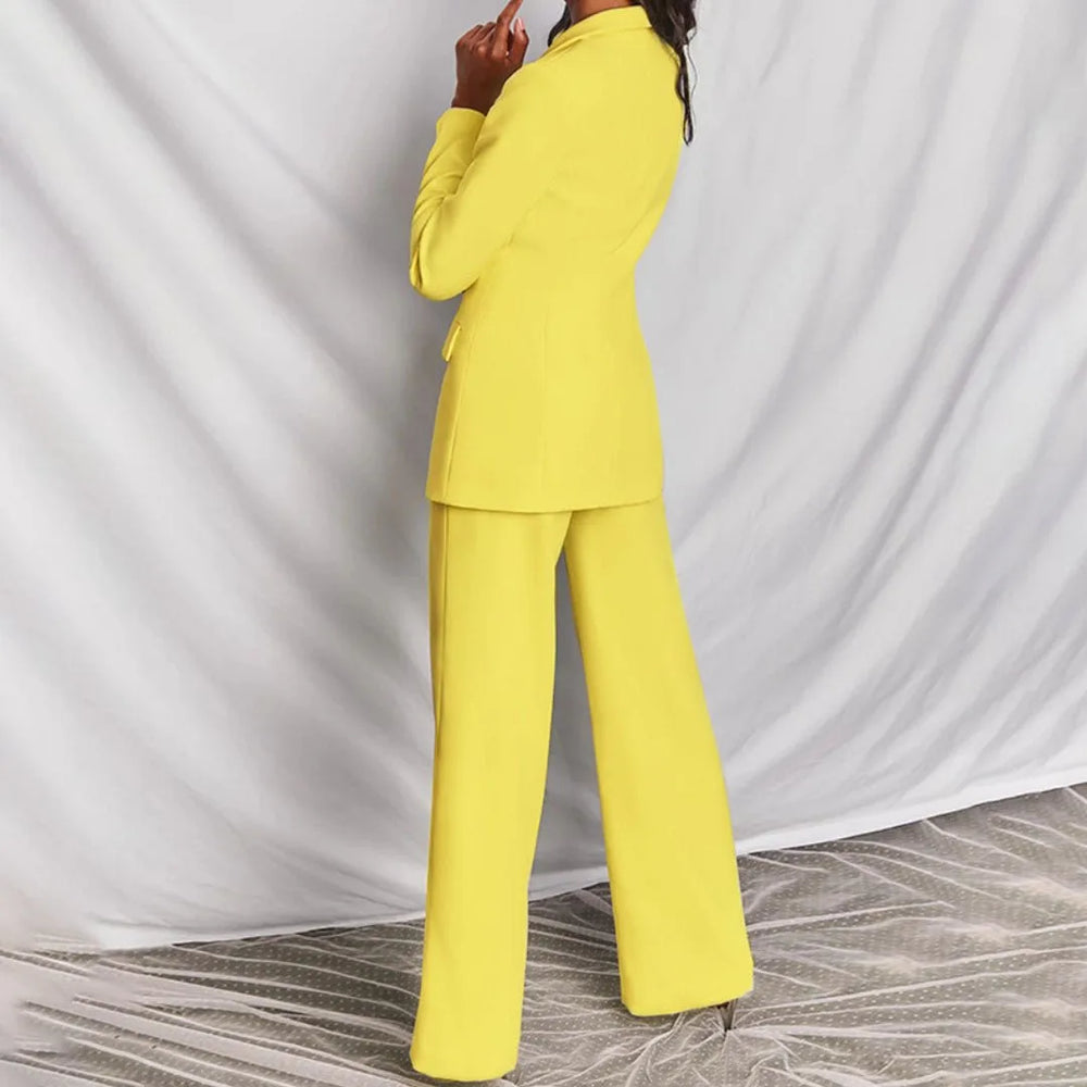 Close-up detail of a yellow tailored blazer suit set on a model