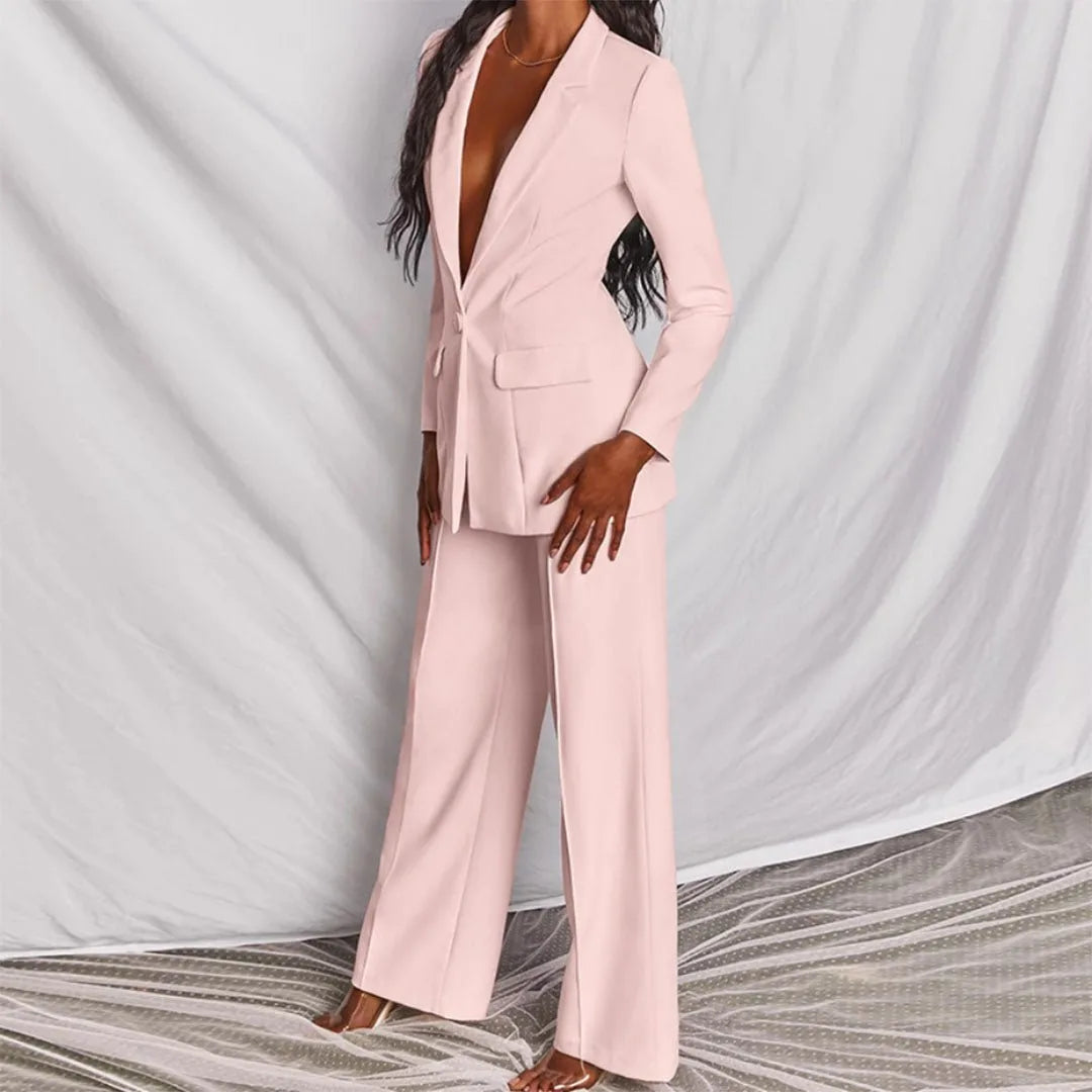 Model posing in a yellow tailored blazer suit set, styled look