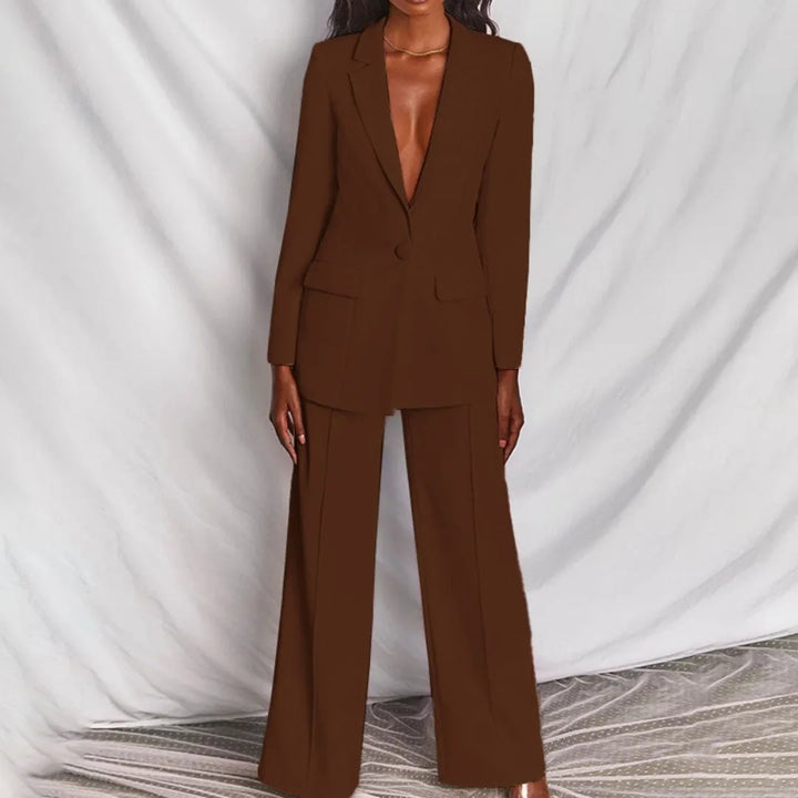 Model in a yellow tailored blazer suit set, posed editorial view