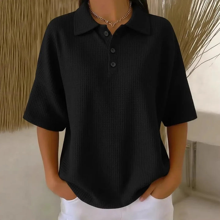 Black waffle knit polo top on model