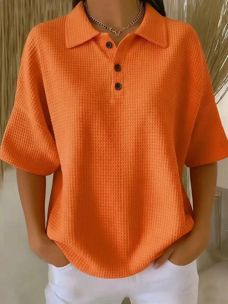 Orange waffle knit polo top on model