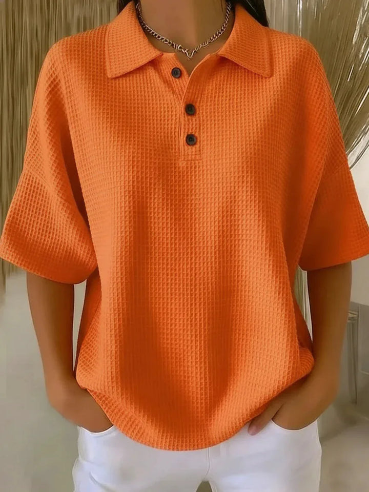 Orange waffle knit polo top on model