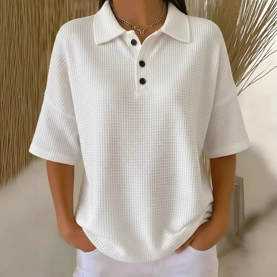 Red waffle knit polo top on model, side profile view