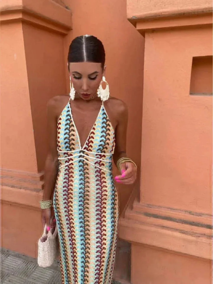 Close-up detail of multicolor crochet fabric and halter neckline on a maxi dress