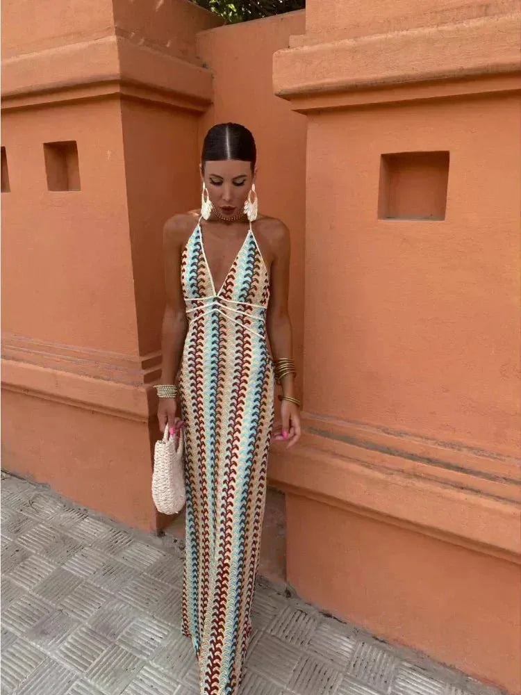 Model facing forward in a multicolor crochet halter maxi dress