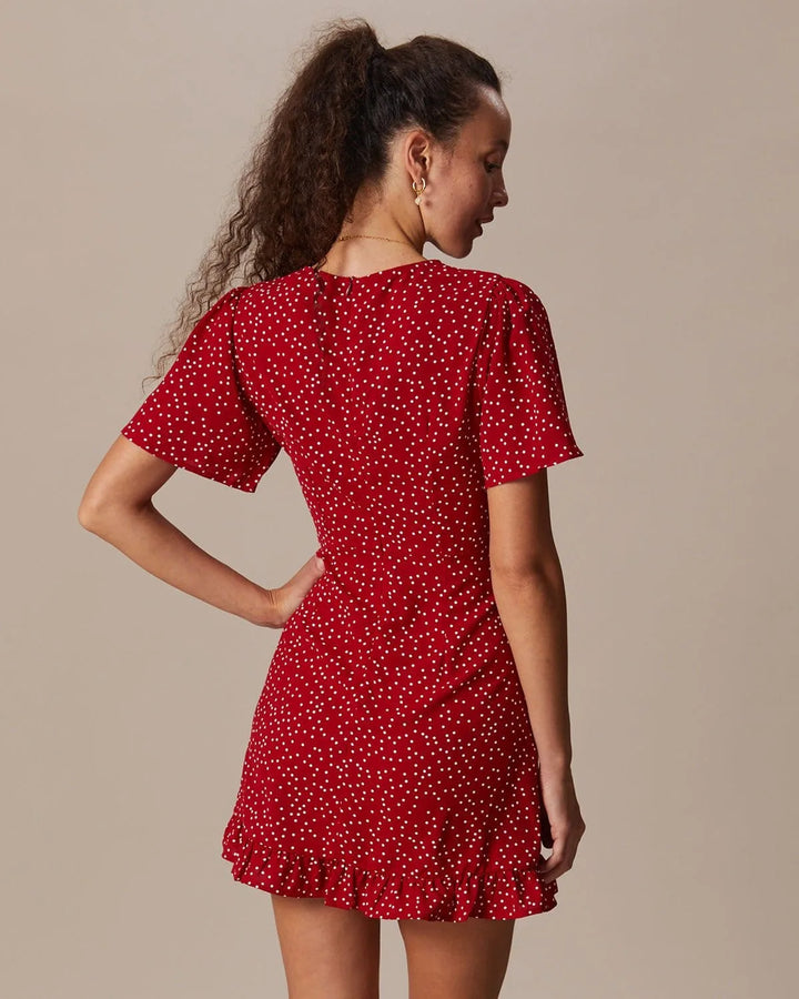 Model posing in a red tie-front mini dress showing full-length styling