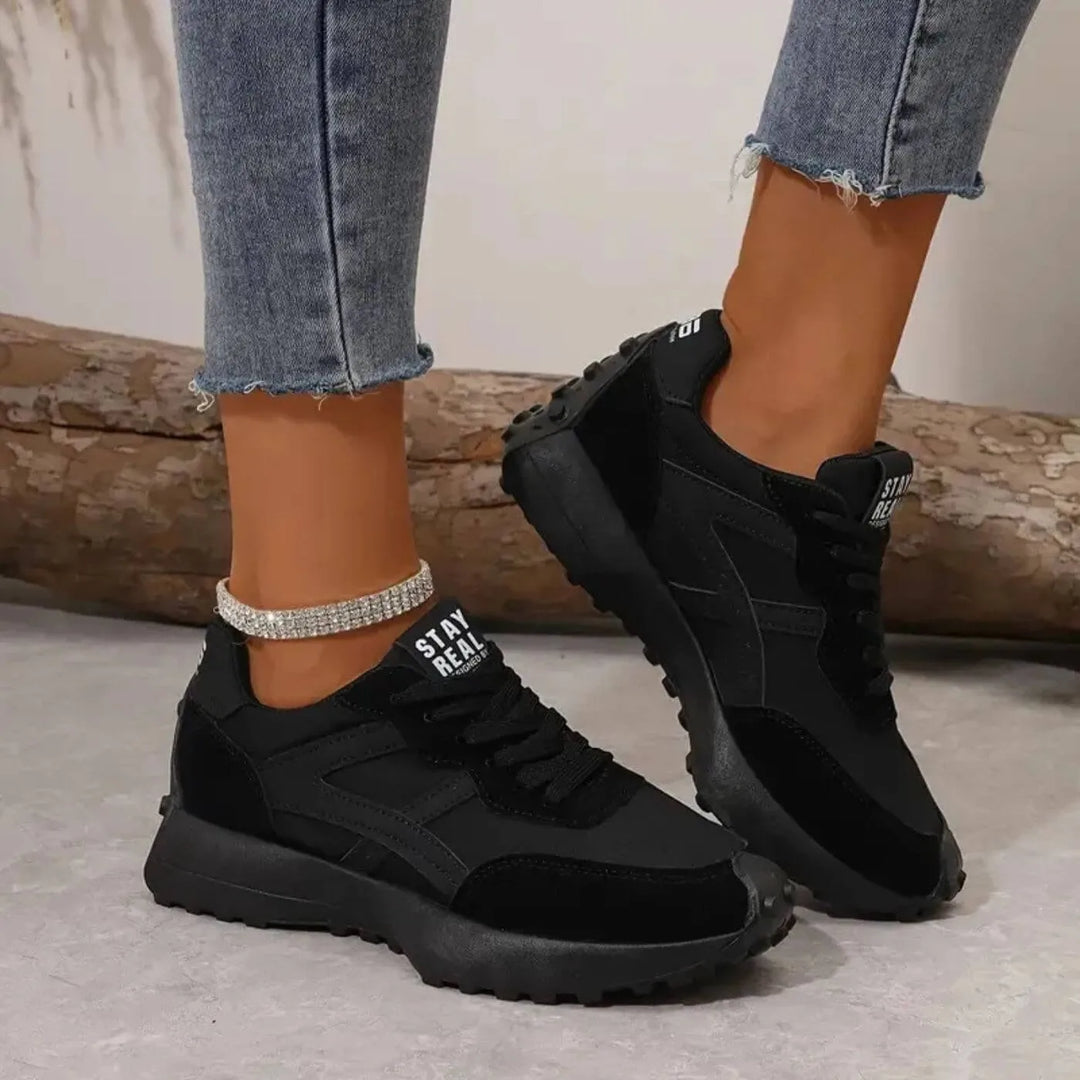 Black retro lug sole sneaker, side profile view