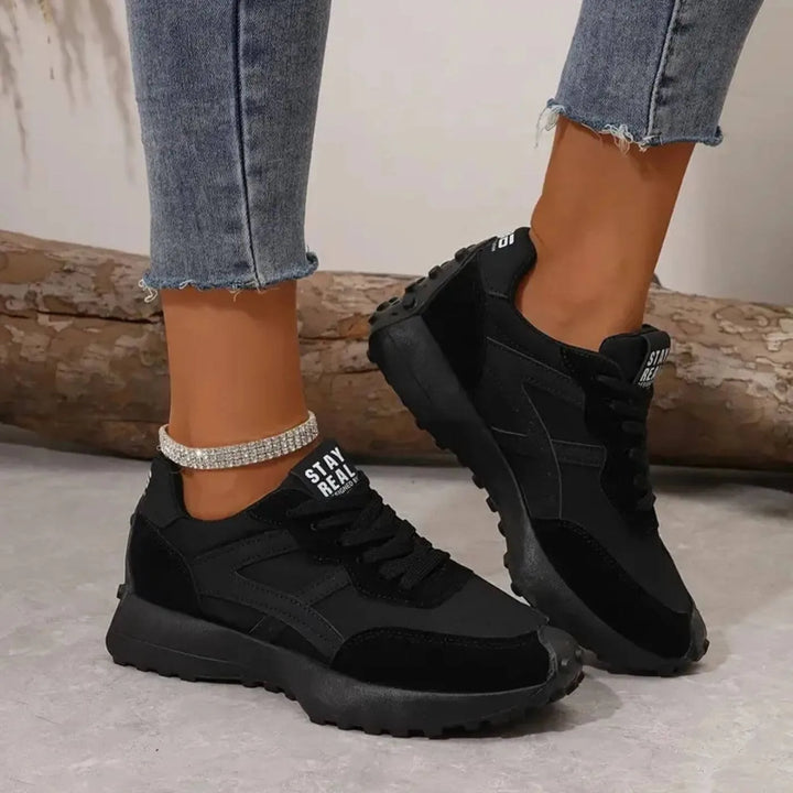 Black retro lug sole sneaker, side profile view
