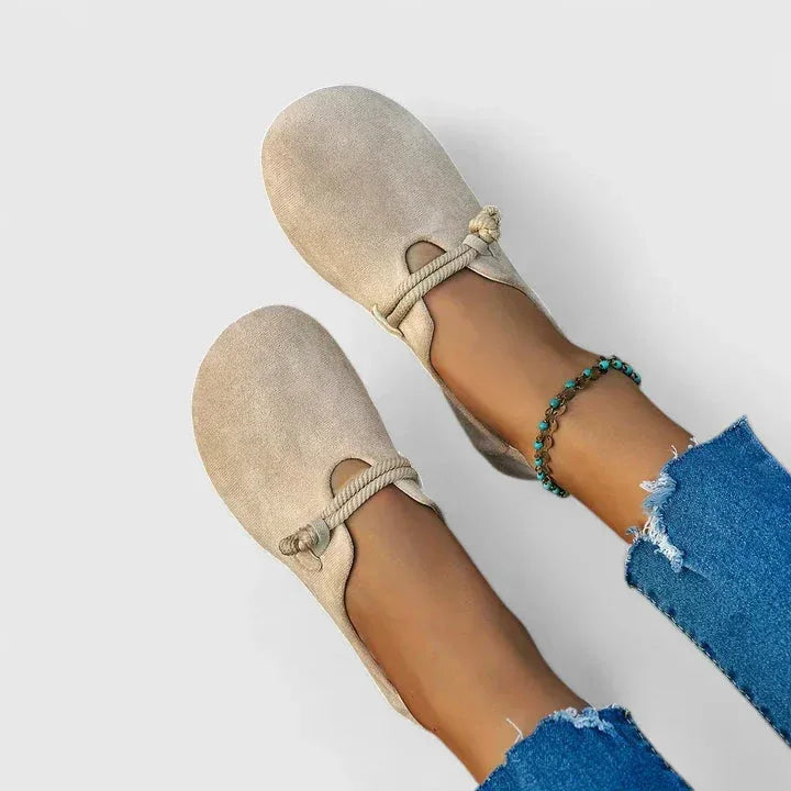 Beige rope-tie flat sandal, three-quarter angle view