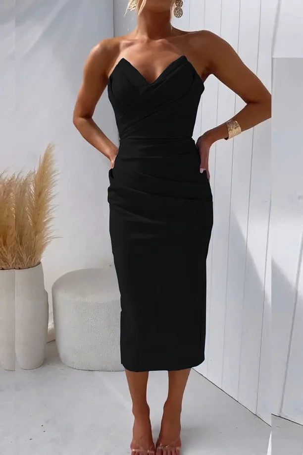 Model wearing a black strapless ruched midi dress
