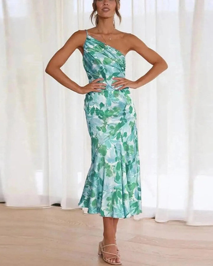 Side view of model wearing an orange floral one-shoulder midi dress