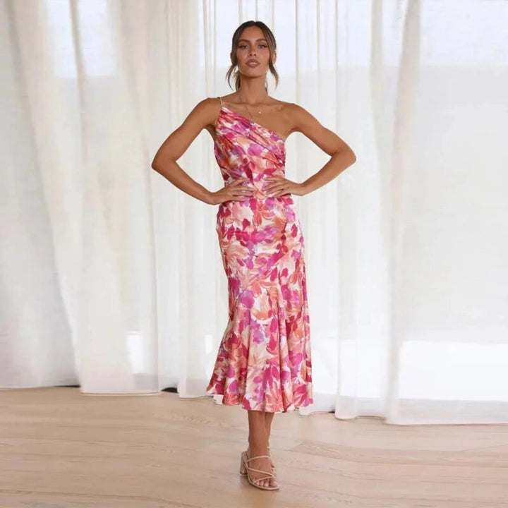 Model wearing a pink floral one-shoulder midi dress