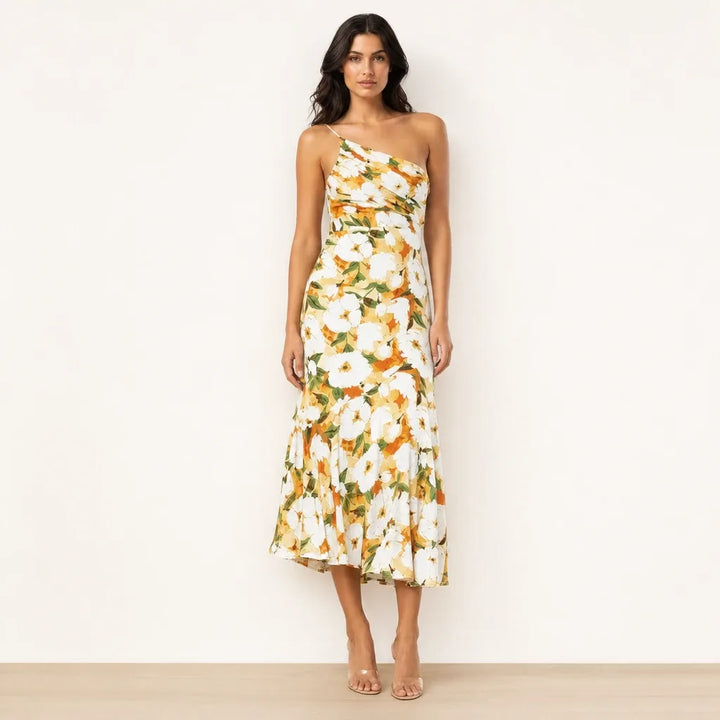 Yellow floral one-shoulder midi dress on model in contrapposto stance