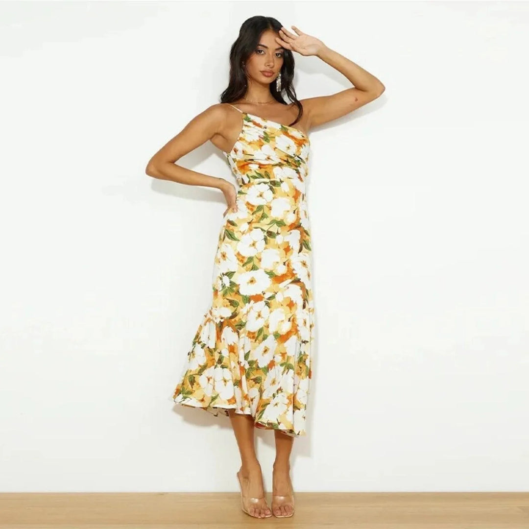 Model wearing a yellow floral one-shoulder midi dress