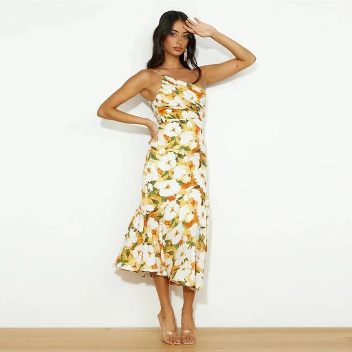 Model wearing a yellow floral one-shoulder midi dress