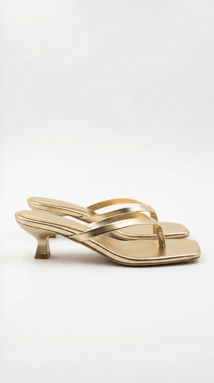 Gold kitten heel thong mule, front view