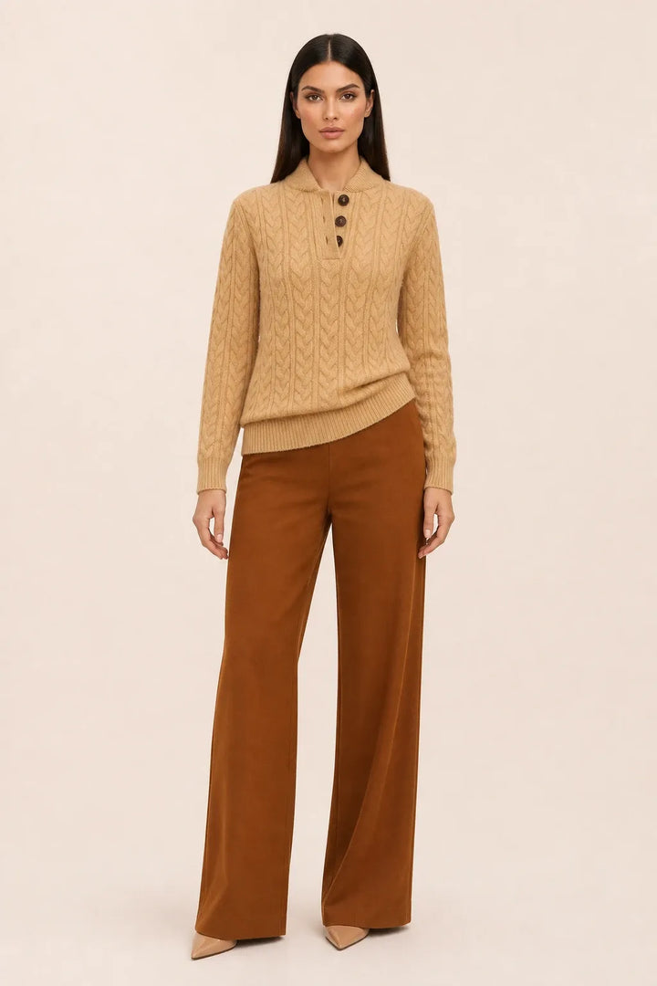 Khaki cable knit button-neck sweater on a model in a contrapposto stance