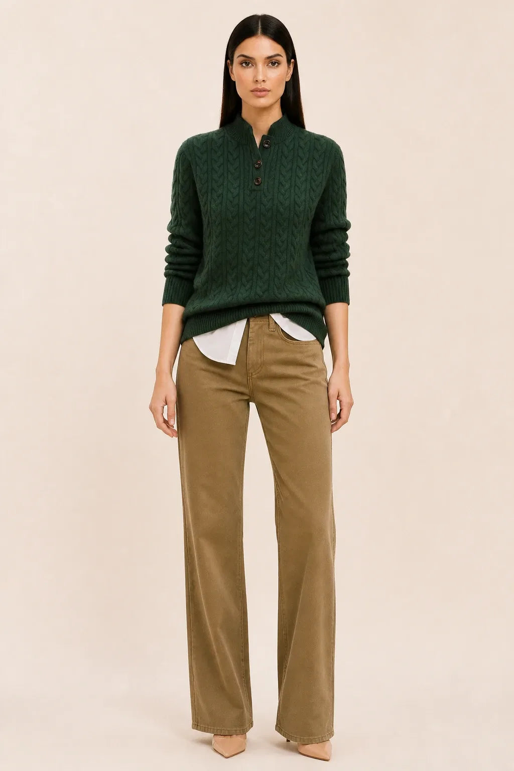 Olive cable knit button-neck sweater on a model in a contrapposto stance