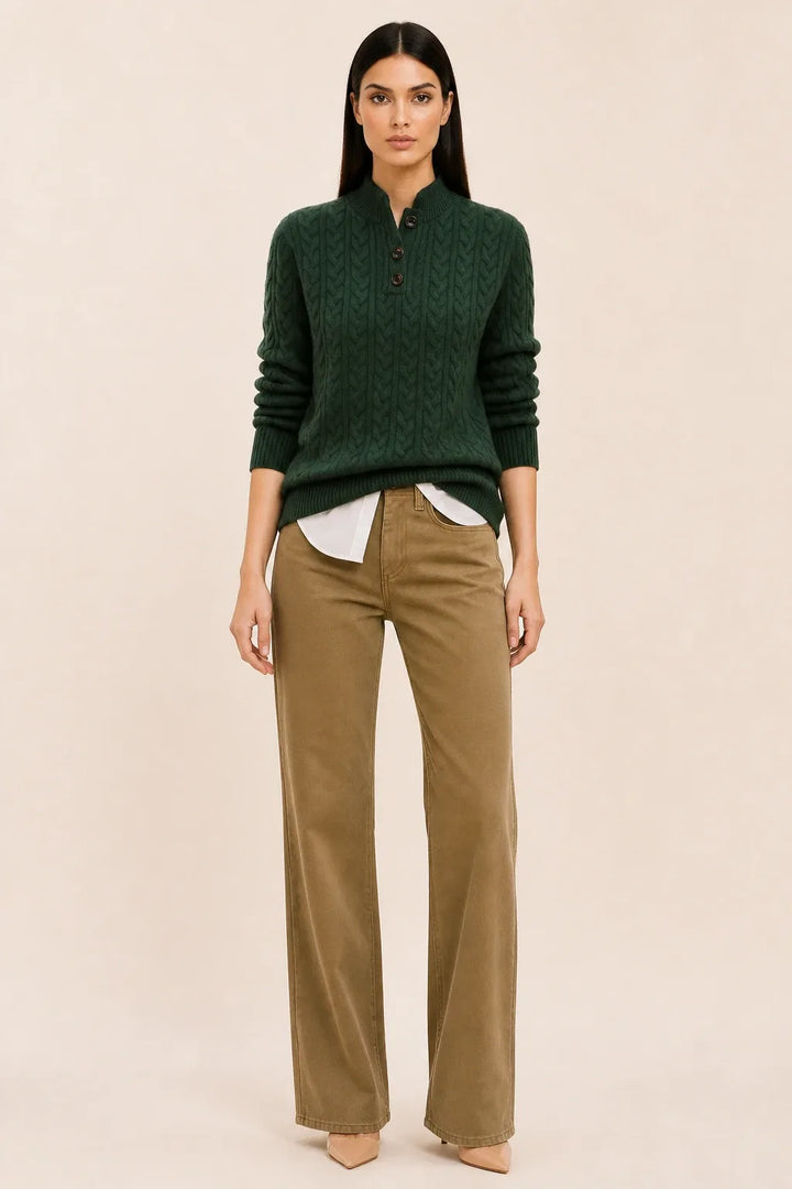 Olive cable knit button-neck sweater on a model in a contrapposto stance