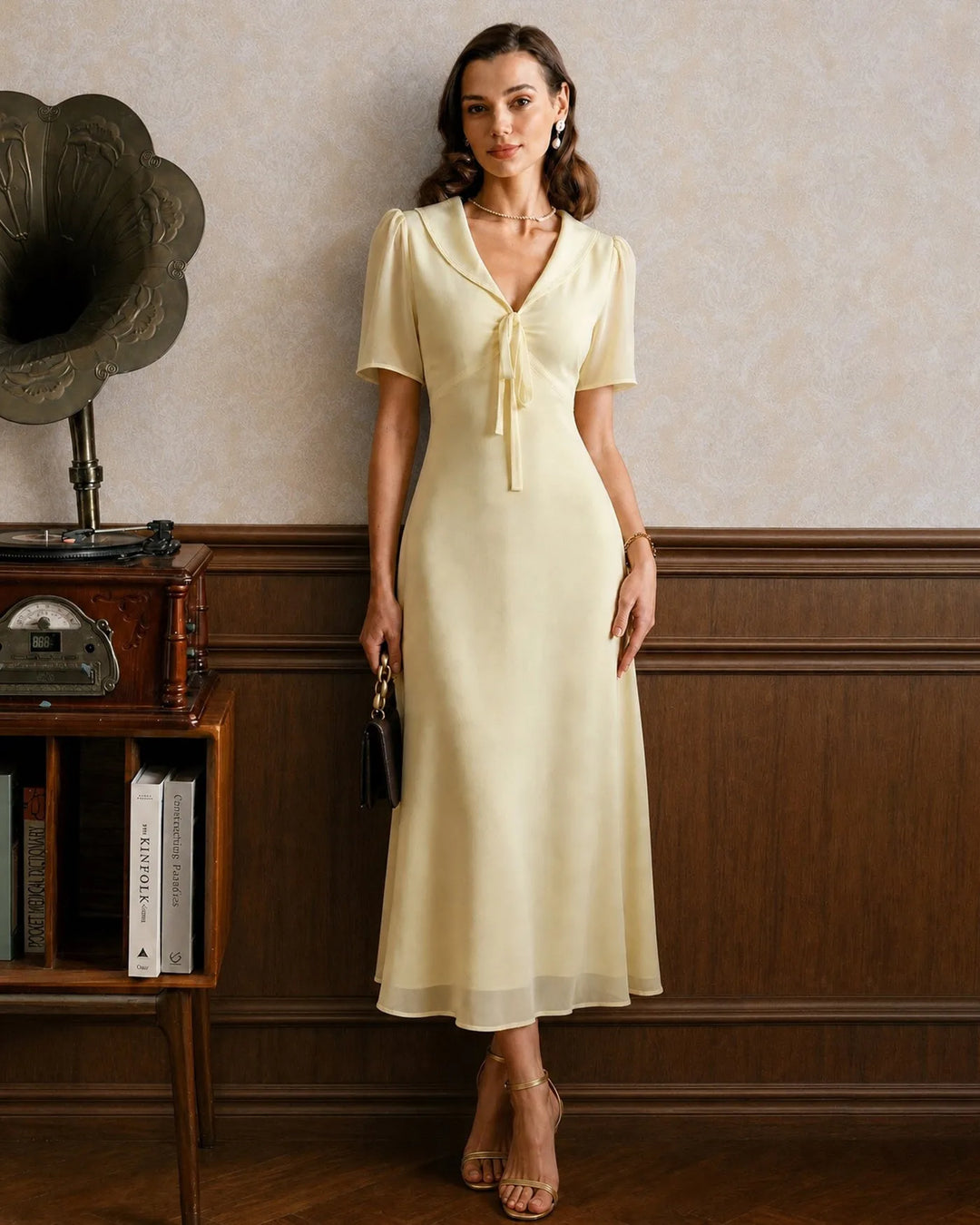 Yellow midi dress with sailor collar, model facing forward