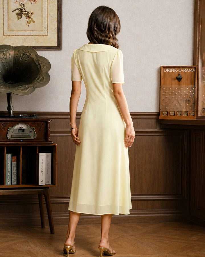 Yellow sailor collar midi dress, model in side profile