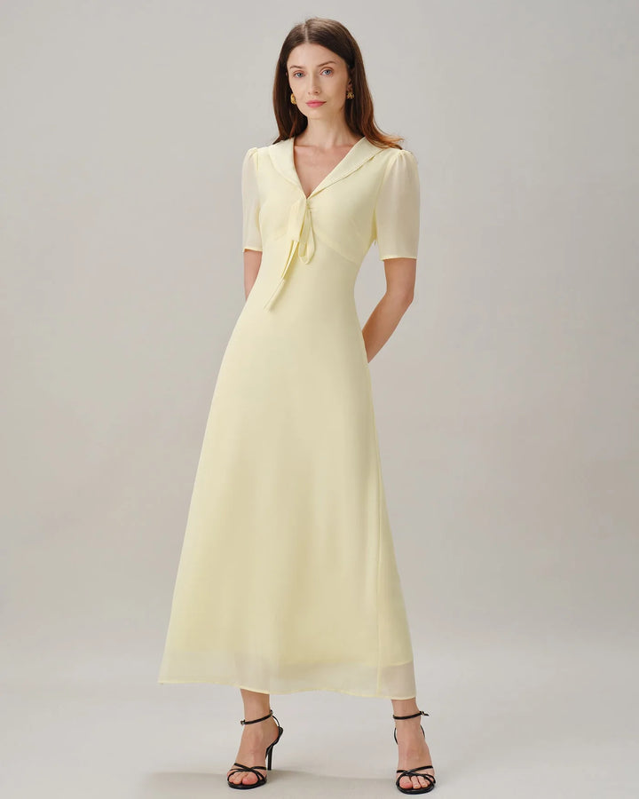 Yellow sailor collar midi dress shown from rear on standing model