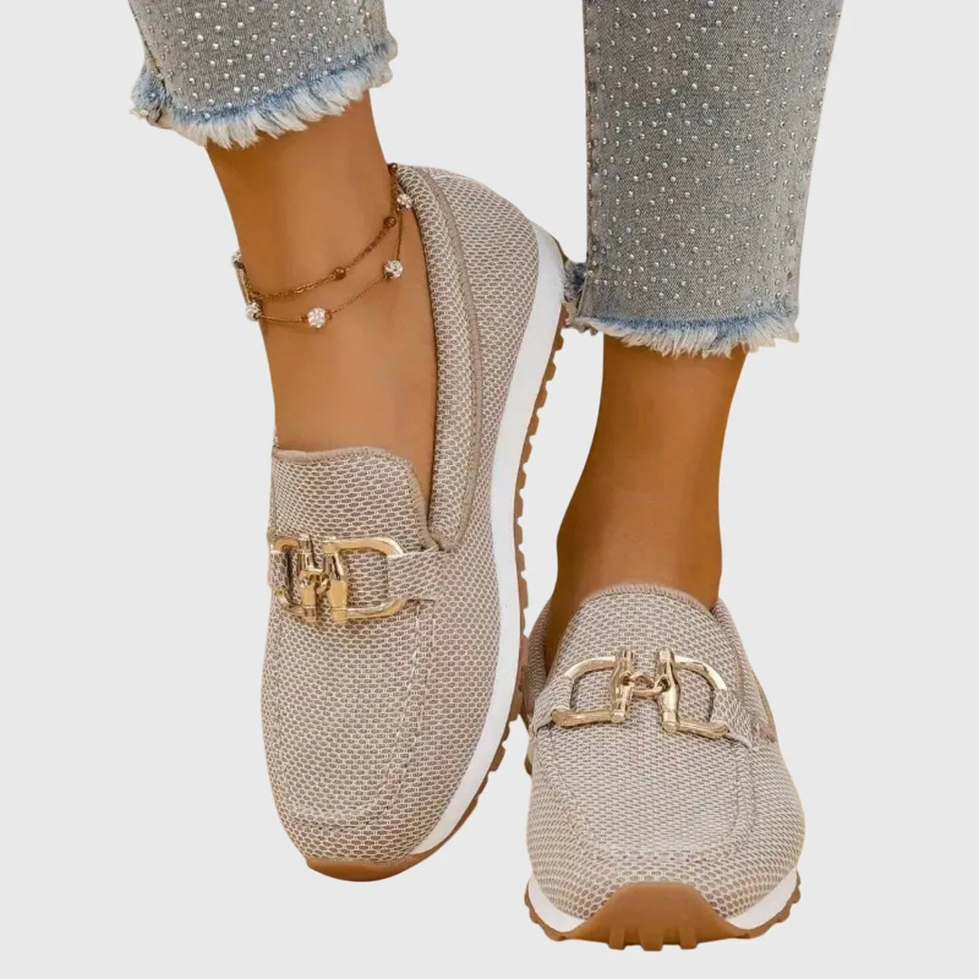 Beige platform loafer with gold horsebit detail, front view