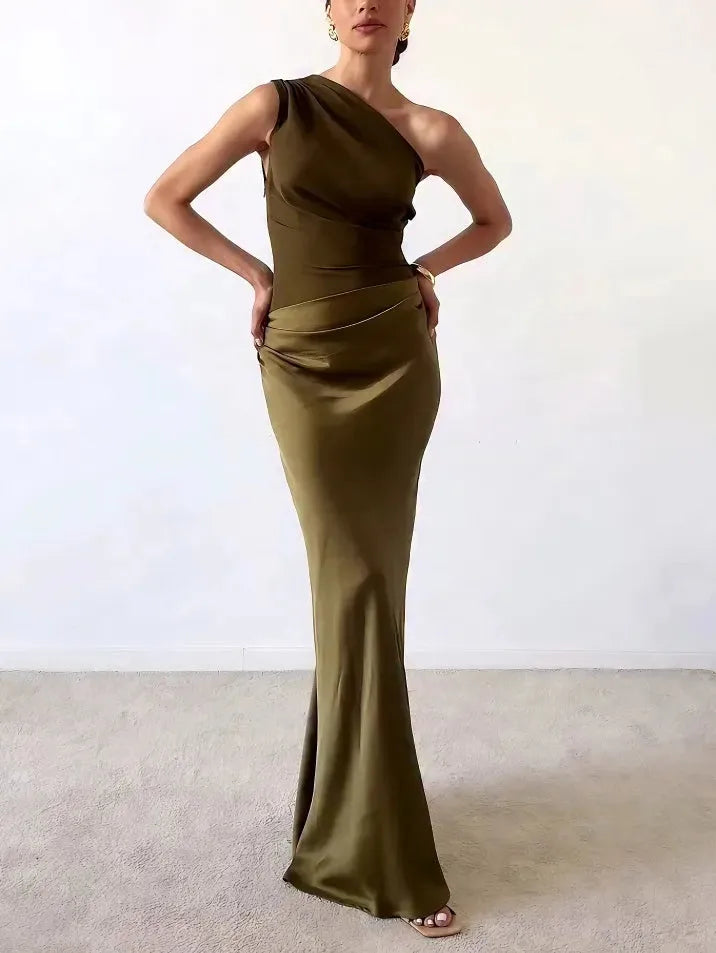 Dark green one-shoulder floor-length gown on a model in a three-quarter turn