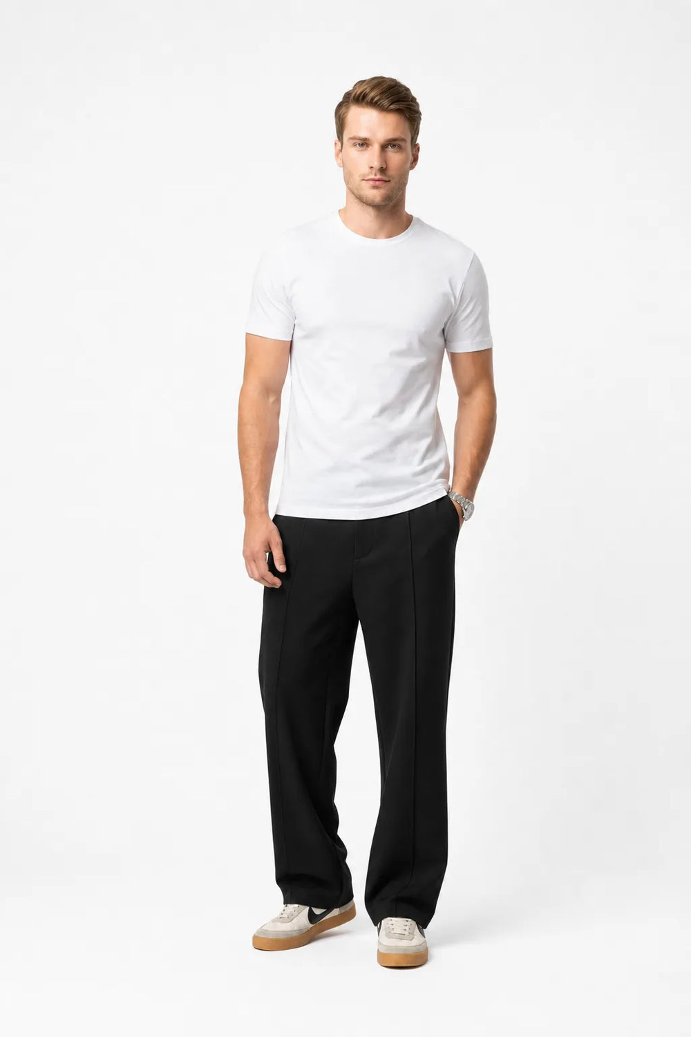 Black pleated wide-leg trousers on a model in a contrapposto stance