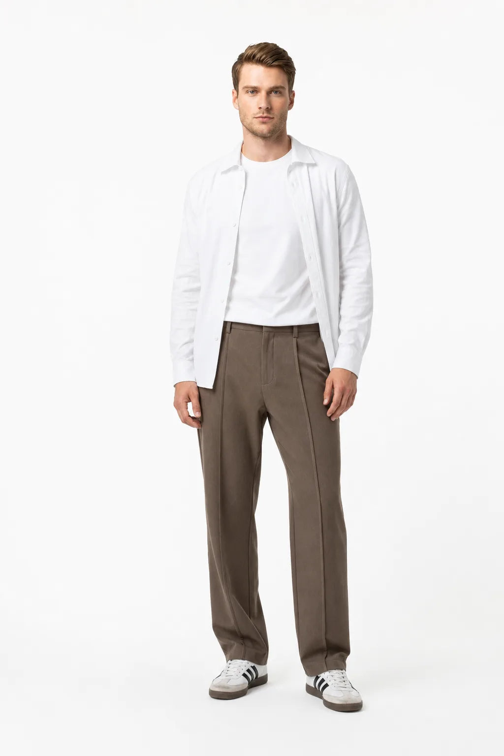 Brown pleated wide-leg trousers on a model in a contrapposto stance