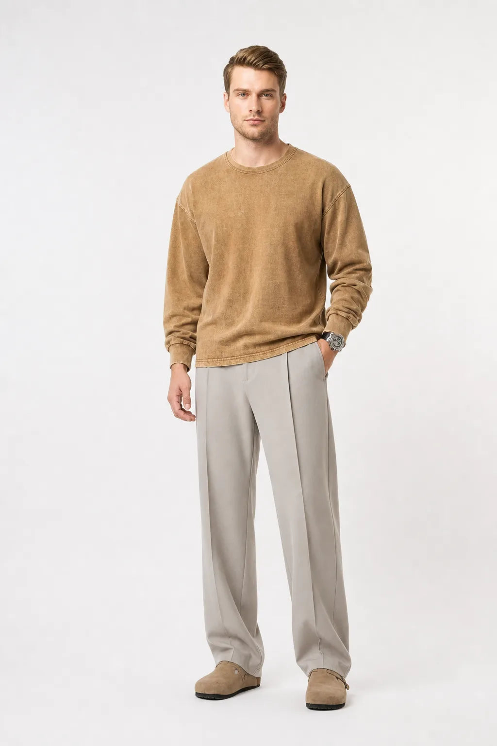 Khaki pleated wide-leg trousers on a model in a contrapposto stance