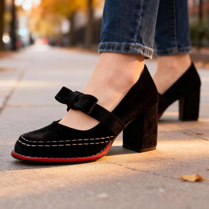 Black velvet Mary Jane pump with bow detail, three-quarter view