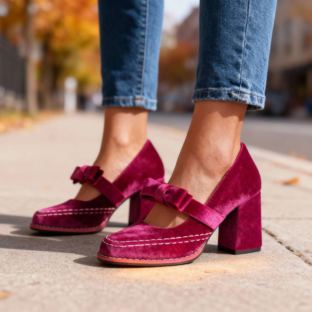 Pink velvet Mary Jane pump with bow detail, front view