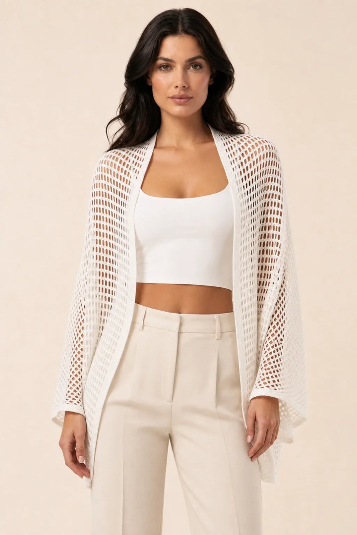 White net knit open-weave cardigan on model in contrapposto stance